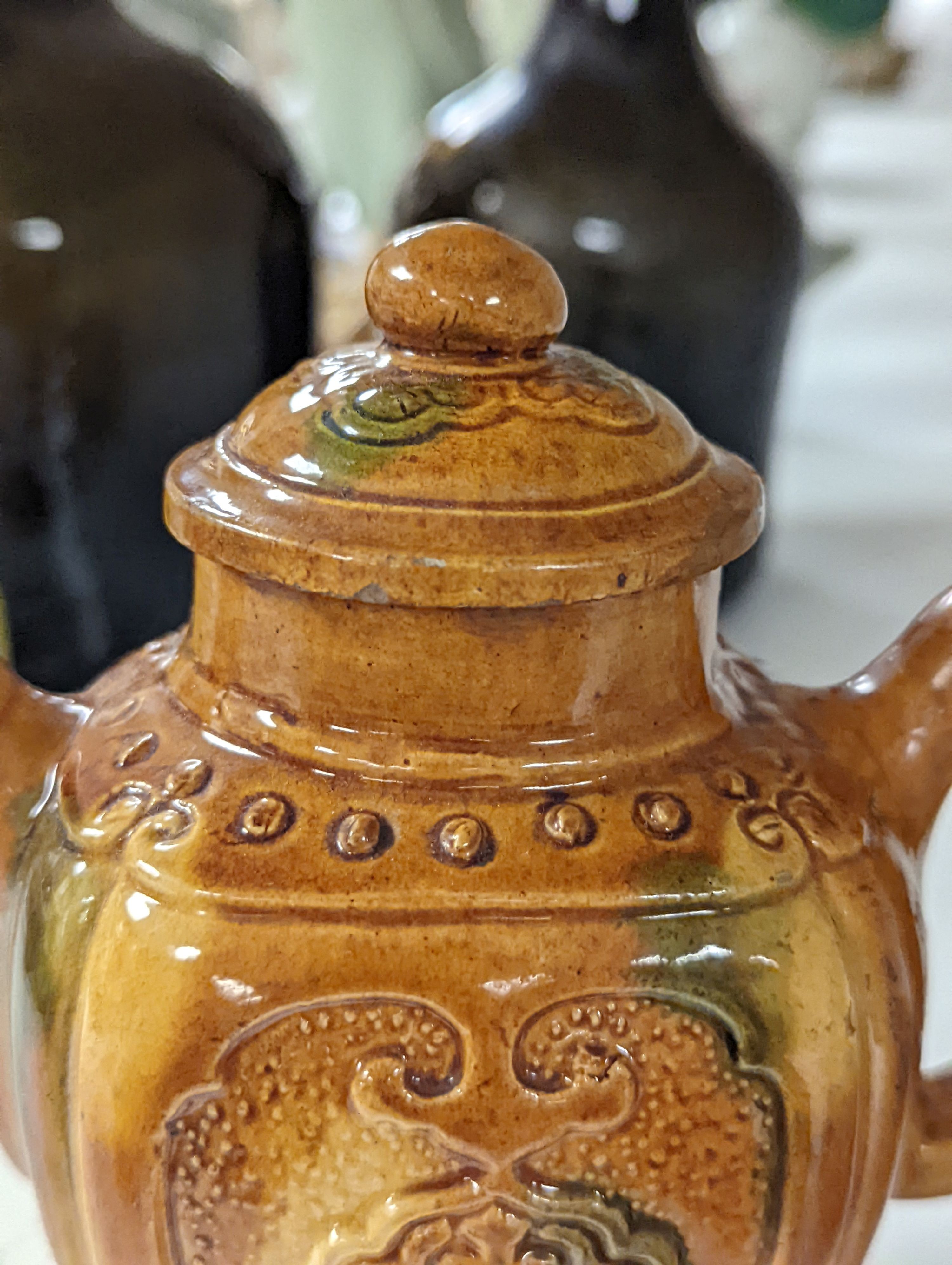 A Chinese enamelled yellow-ground jar and cover, a pottery teapot and cover and a flambe vase, latter 13cm